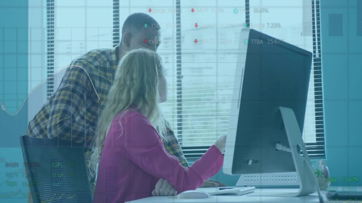 Woman clicking mouse and analyzing finance data with colleague observing chart arrows trends