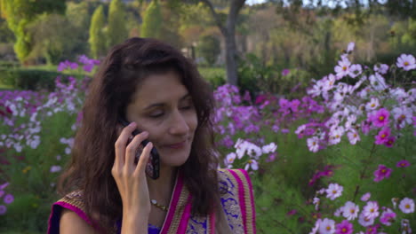 Tourist-On-Cell-Phone-in-sari-walking