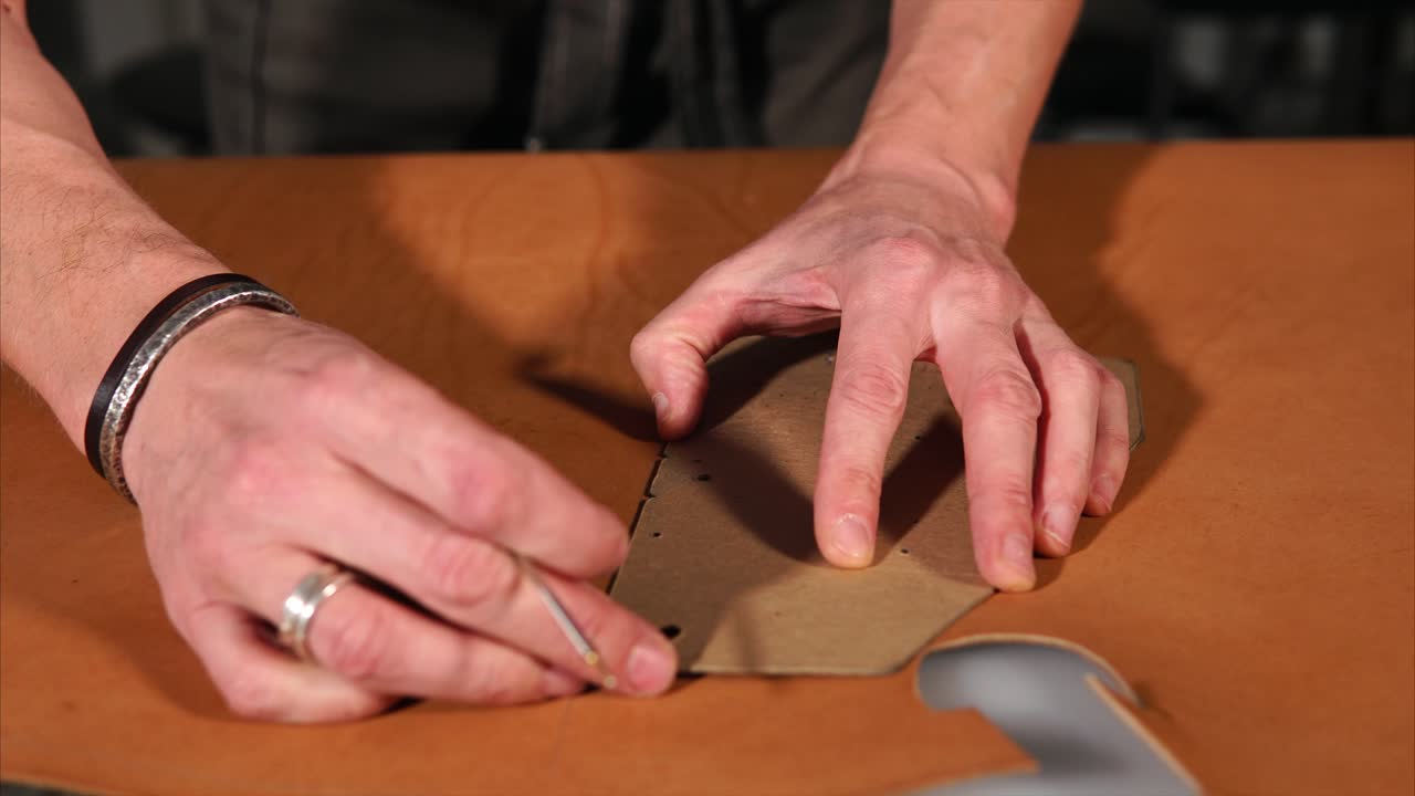 Leatherworking process: Cutting leather with a pattern