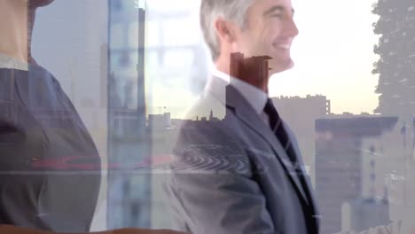 Animation-of-happy-caucasian-businesspeople-shaking-hands-over-cityscape