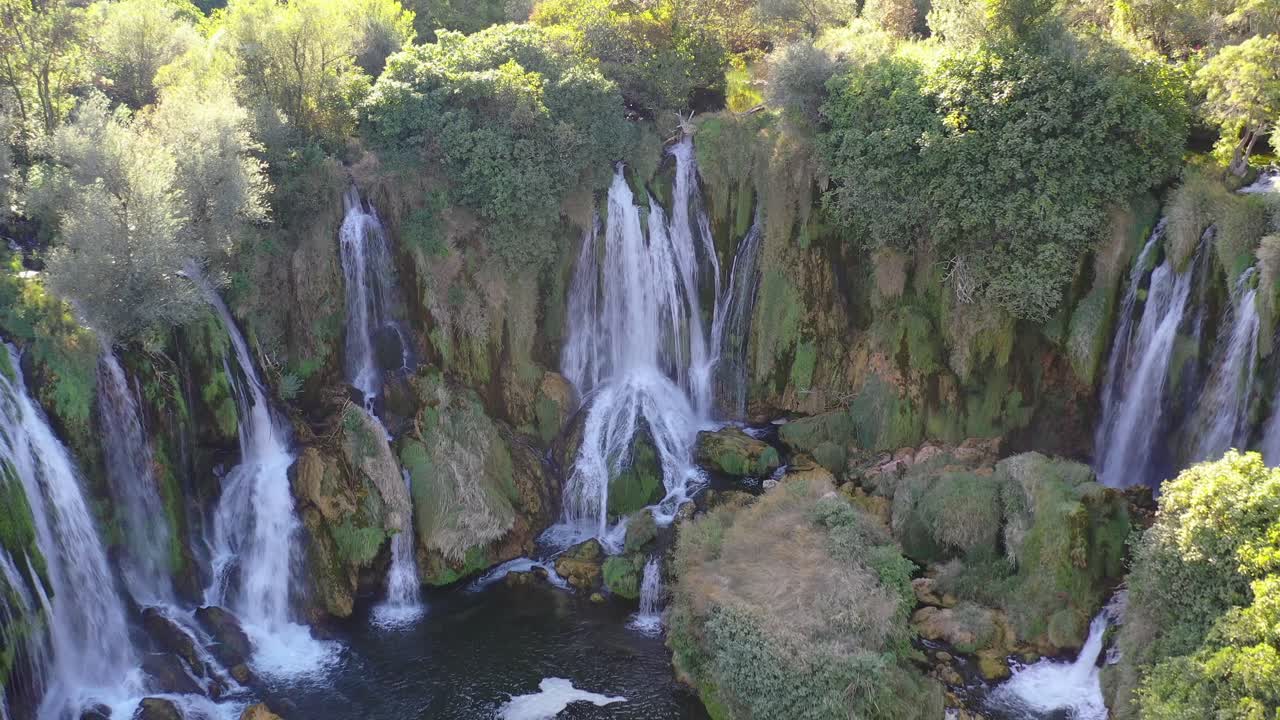 Kravica Waterfalls in Bosnia and Herzegovina within the Trebizat river system, Aerial dolly out shot