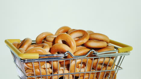 small bagels in a shopping trolley in miniature 4k video