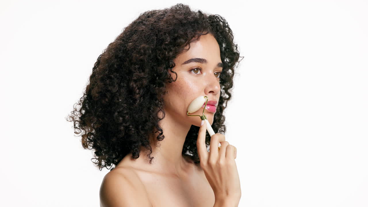 Woman using a face roller