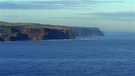 Establishing-Drone-Shot-of-North-Yorkshire-Coastline-Cliffs-UK