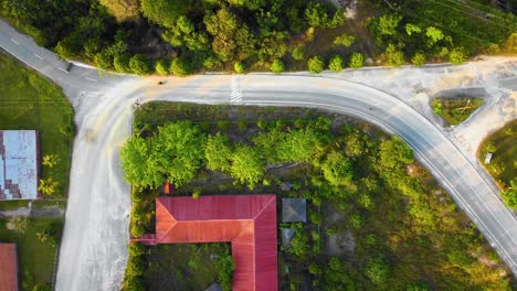 Amazing-cinematic-4K-residential-drone-footage-after-deforestation-issue-consists-of-many-homes,-road,-trees,-lake-and-infrastructure-in-the-middle-of-tropical-forest-located-in-Riau,-Indonesia