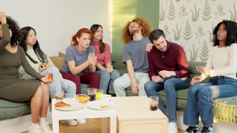 friends witnessing the end of a match, their team losing