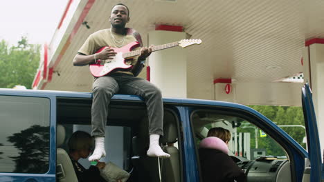 people with a van in a gas station