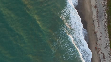 waves of an ocean crashing for a feeling of relaxation on the beach overhead