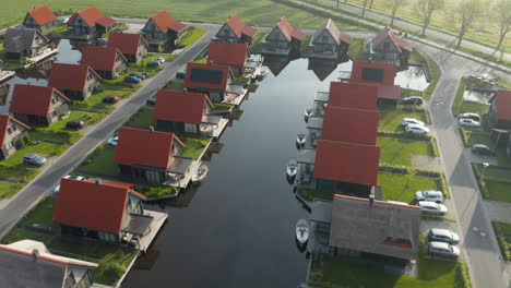 luxurious holiday resort and polder with boats on jetty at waterstaete ossenzijl in netherlands