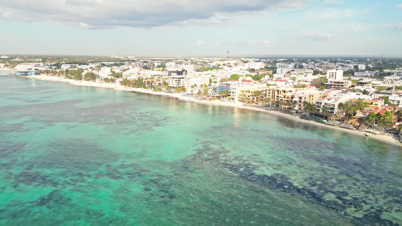 Playa del carmen beach with turquoise water and coastal buildings, aerial view