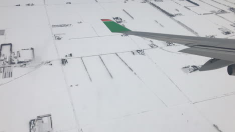 wing-plane-above-land-of-Hokkaido,-Japan