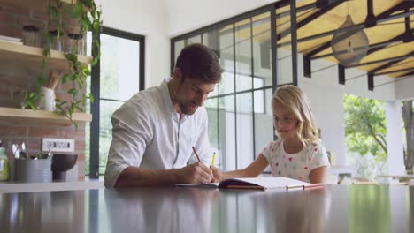 father helping her daughter in homework at home 4k