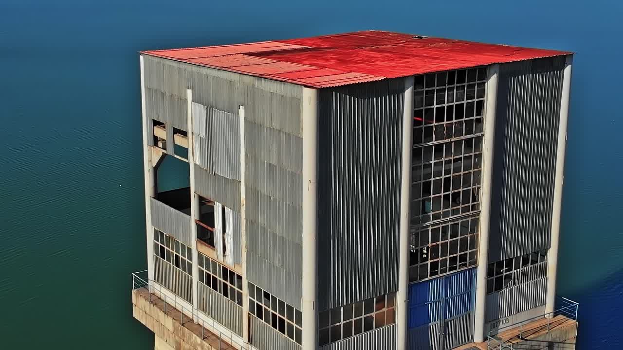 Old industrial building by water in Georgia during daylight