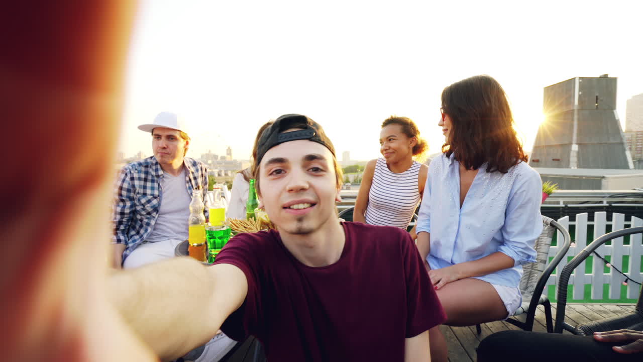 Rooftop Selfie with Friends at Sunset