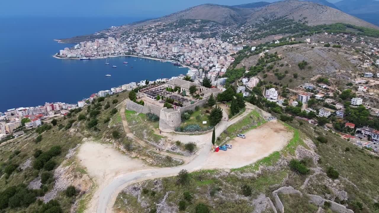 Lekursi Castle aerial drone video above Saranda Albania city sea view