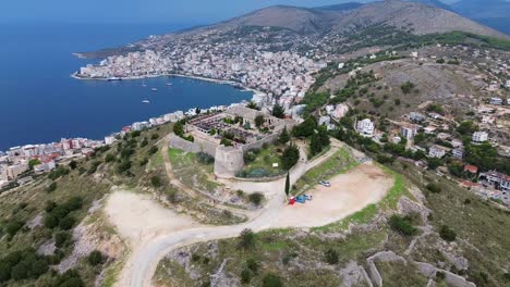 lekursi castle aerial drone video above saranda albania city sea view