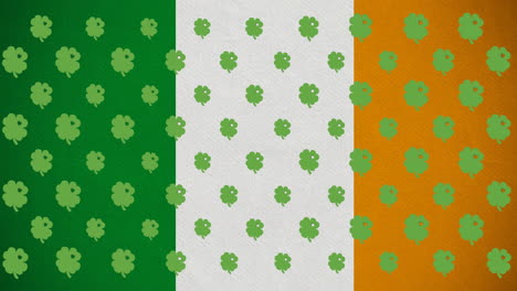 digital animation of multiple clover leaves moving against irish flag