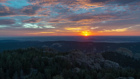 timelapse, stunning sunset under clouds over mountain peaks horizon, colorado usa