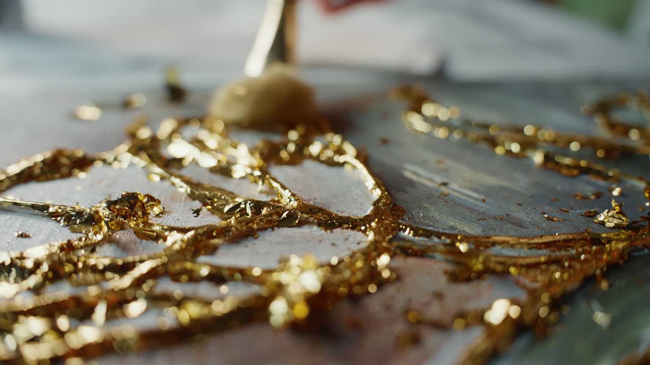 Applying Gold Leaf to an Abstract Painting