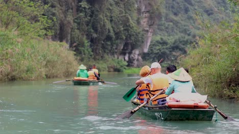 rowboats navigating a serene river in ninh binh