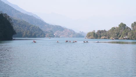 stable shot of beautiful fewa lake with few boats in a distance