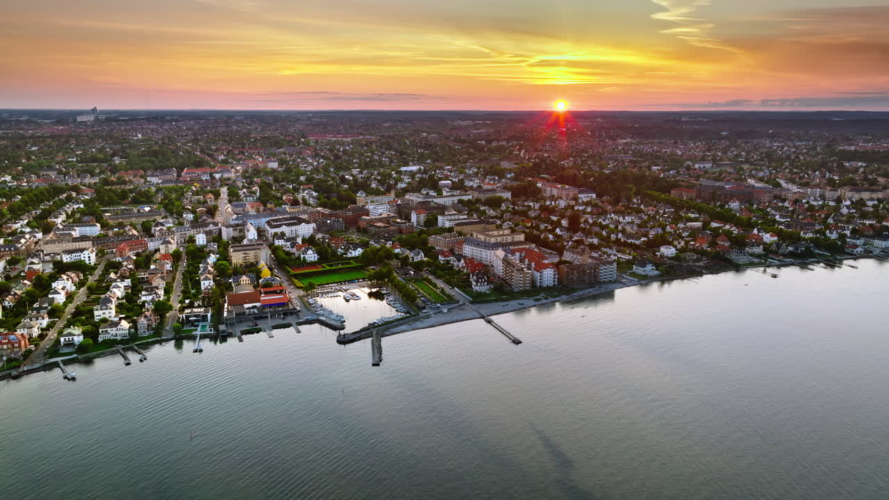 Aerial drone view of Osterbo Nord, Nordhavn harbour area at the coast of the Oresund at sunset