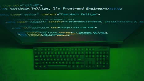 Computer Screen Displaying Code and Keyboard