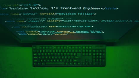 computer screen displaying code and keyboard