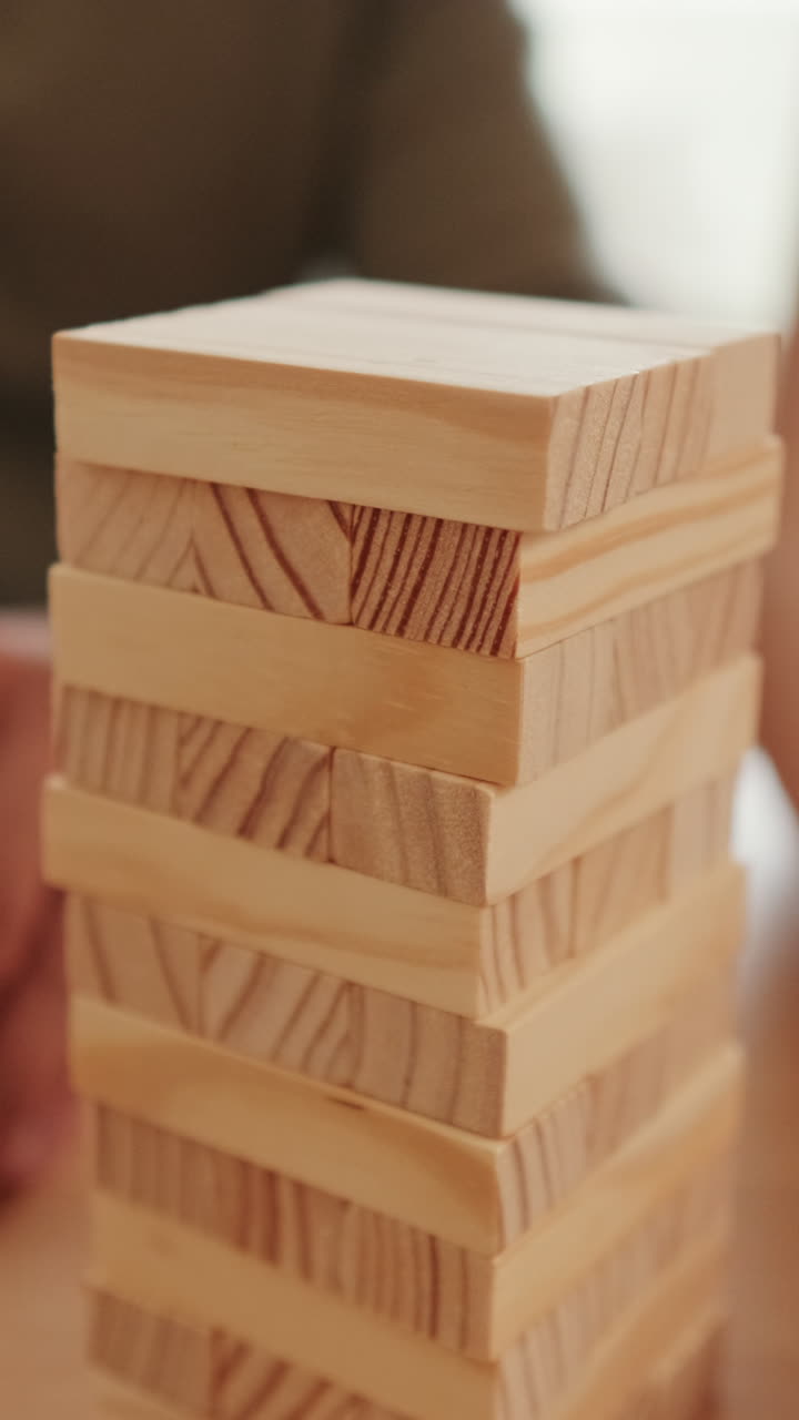 Couple Having Fun Playing Jenga at Home