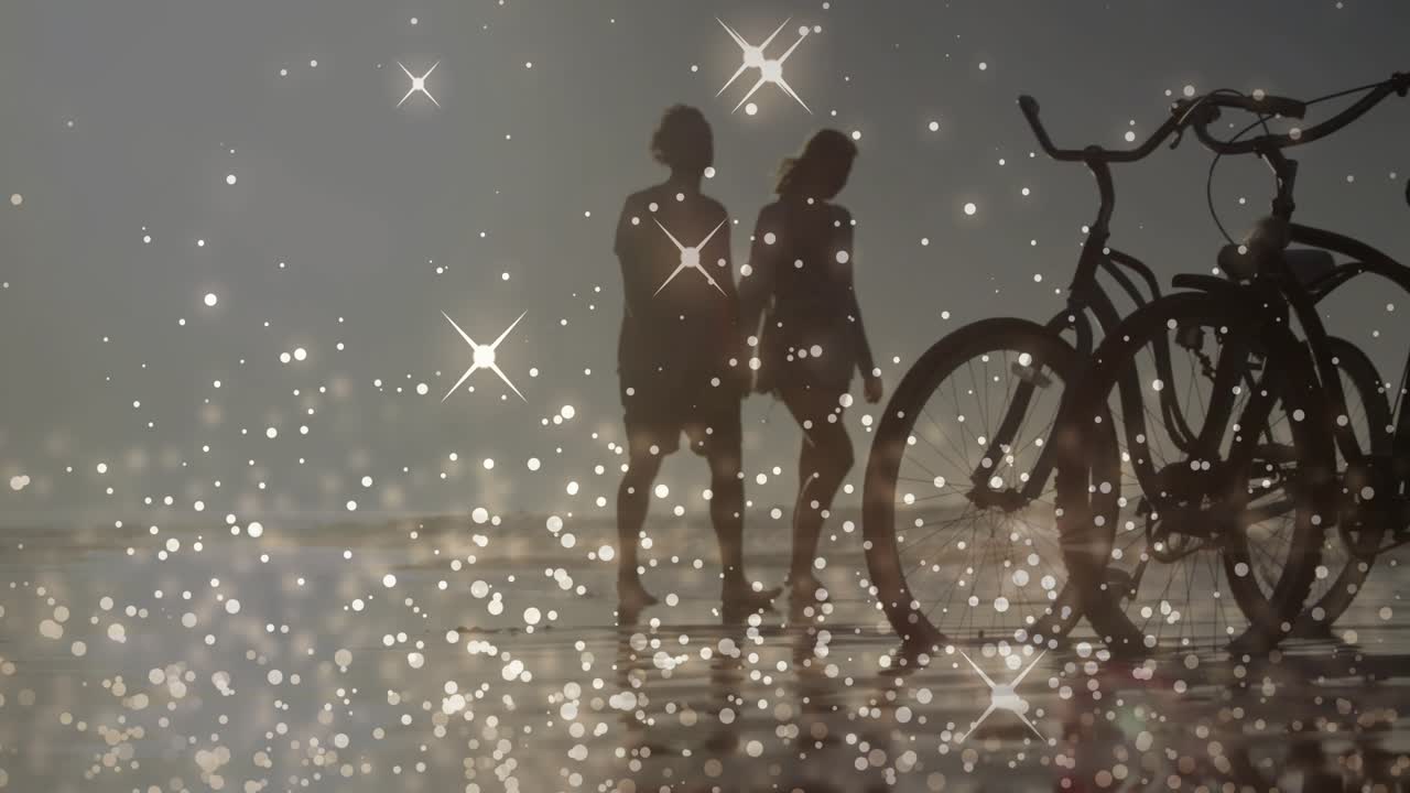 Sunlight shimmering on wet sand drawing senior man and son strolling past bicycle for beach leisure