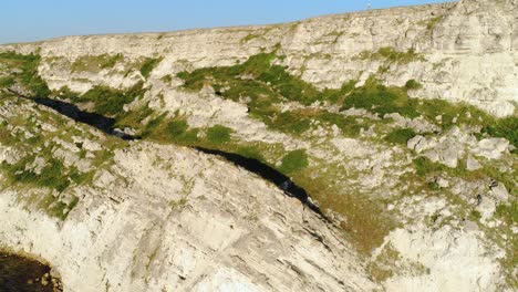 aerial view of coastal cliffs and vegetation