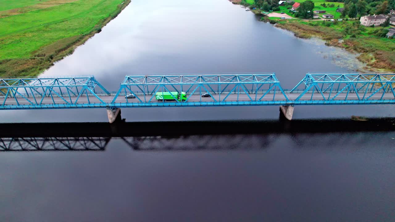 Bridge crossing water in Latvia viewed from above during daylight