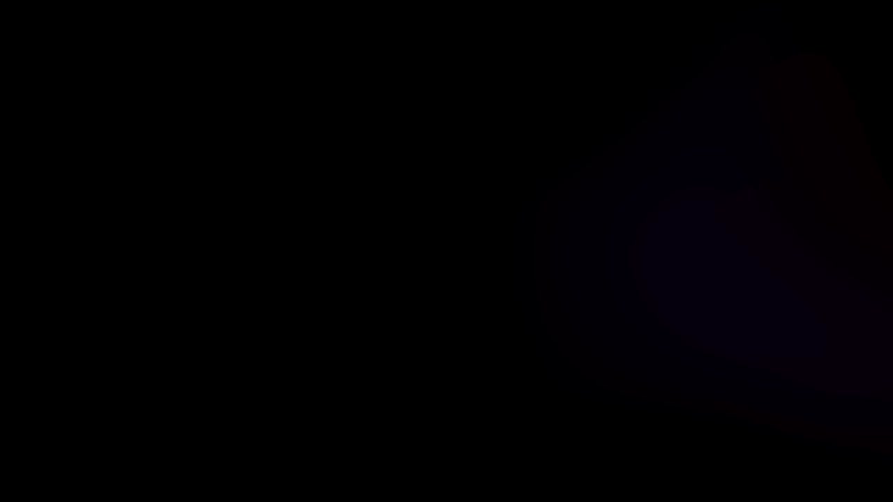 Realistic colorful light leak on black background.