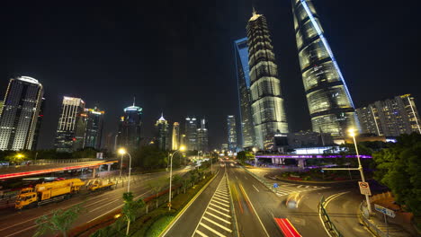 Timelapse of the Shanghai city skyline with traffic passing at nigh
