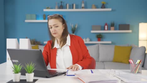 Home-office-worker-woman-finds-what-she-is-looking-for-on-the-table.