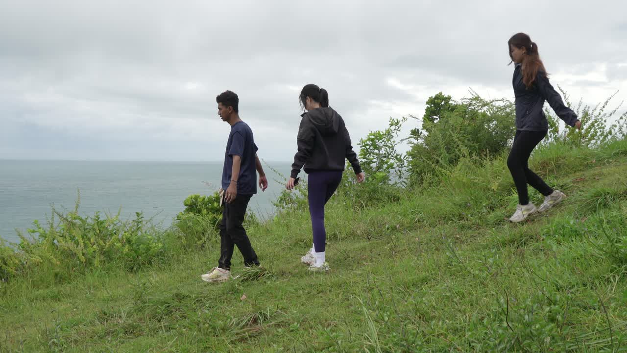 Group Hiking on a Coastal Hill