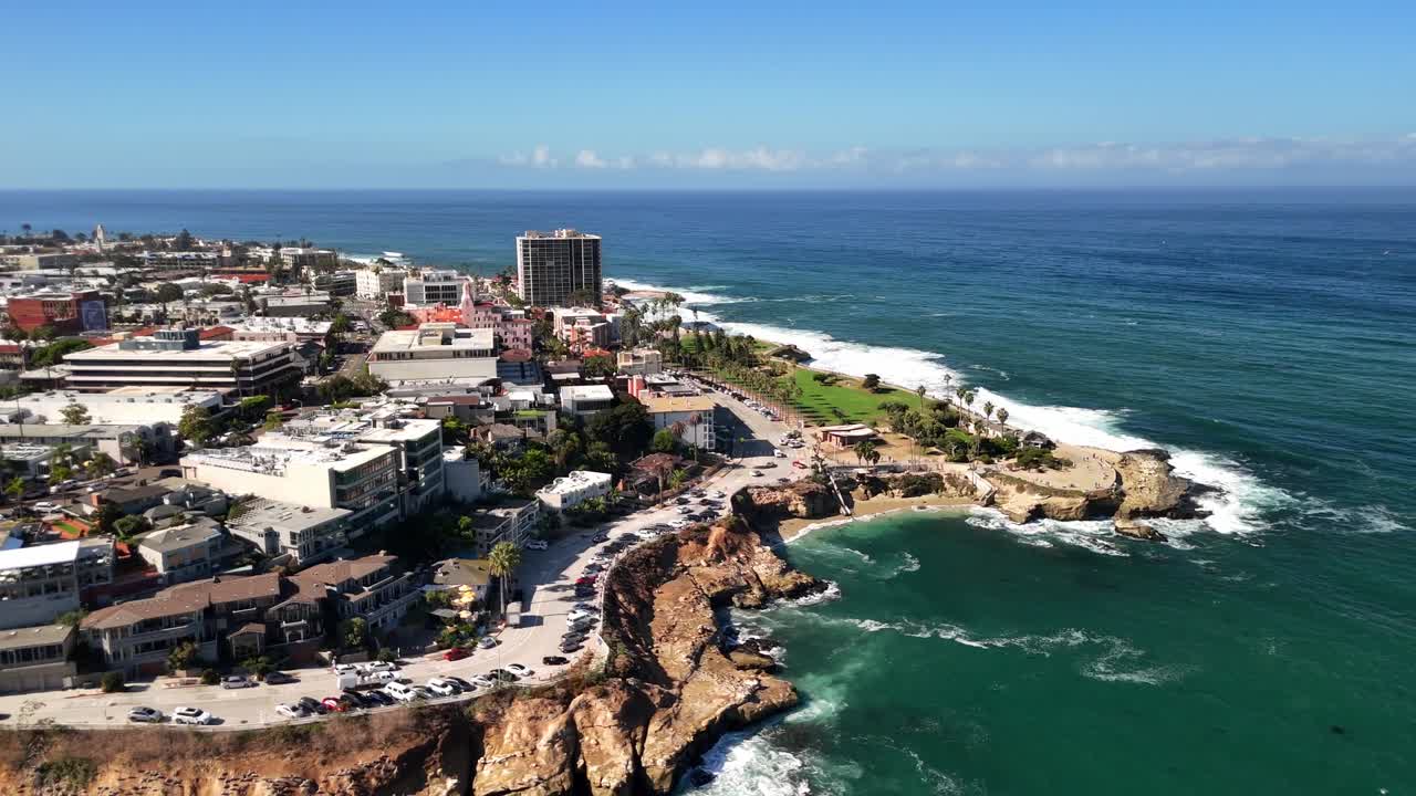 A high-angle pass revealing park areas and scenic viewpoints