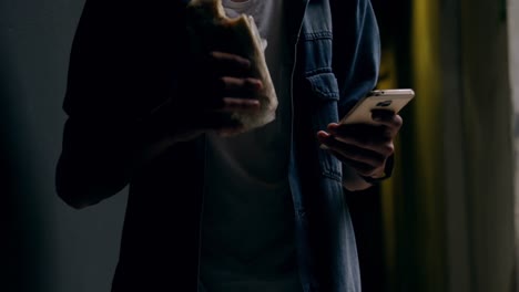 man using mobile phone while having food 4k