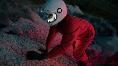 man astronaut on a new planet explores a privy wasteland without water