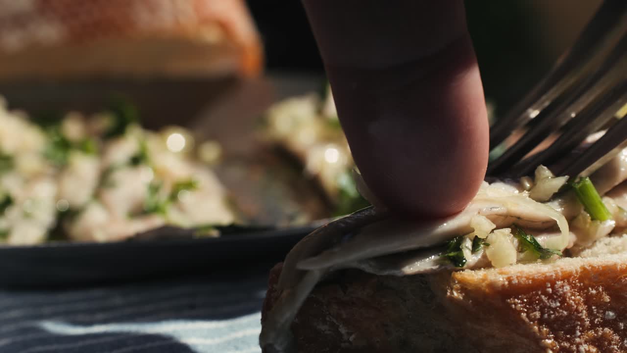 Fresh Sea sardines and Anchovy Fish and Mullus On Display On Ice On Market Store Shop. Seafood Fish Background, close up stand of small salty white fish.