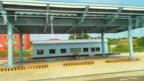 toll booth or toll plaza, passenger shade located along a highway or expressway in bangladesh - pov shot