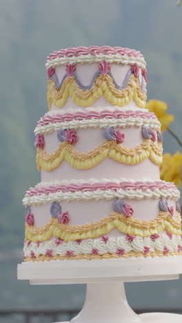 ornate multi-tiered pink and yellow cake
