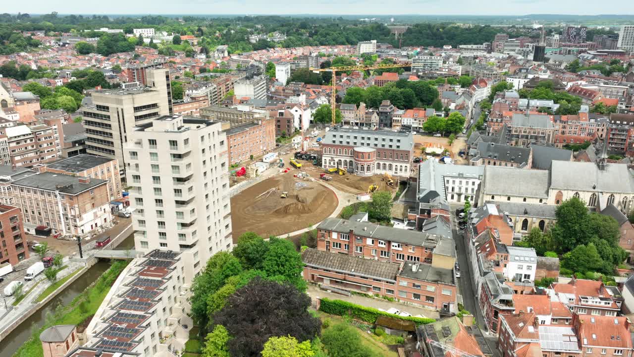 Aerial Orbit Hertogensite Construction Site Leuven With City Reveal