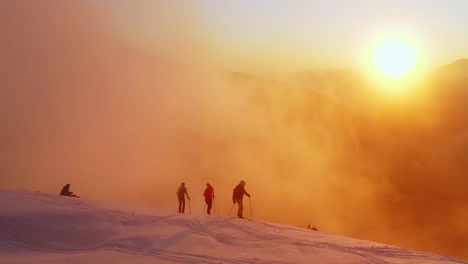 Expedition-of-ski-touring-hikers-exploring-snowy-Dolomites-mountain-ridge-at-sunset