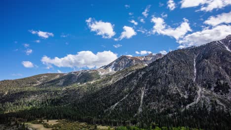 time lapse - beautiful cloudscape moving over mountain range and the valley