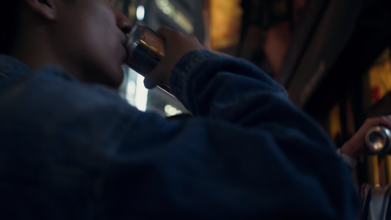 Friends enjoying drinks in the city at night