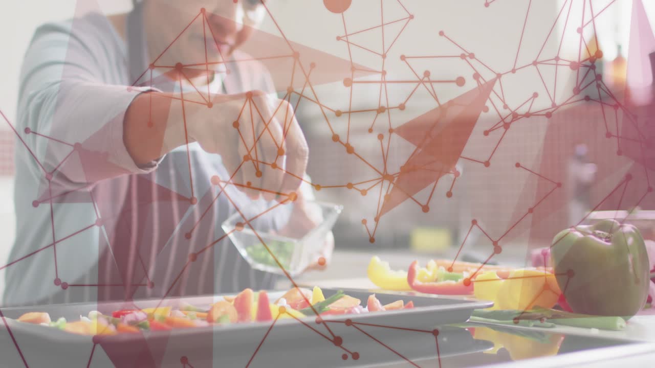 Senior woman picking herb bowl and seasoning bell peppers sprinkling tilting tapping for cooking