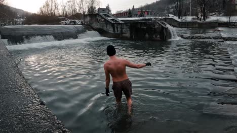 Boy-Walking-in-the-River-during-Winter-Season