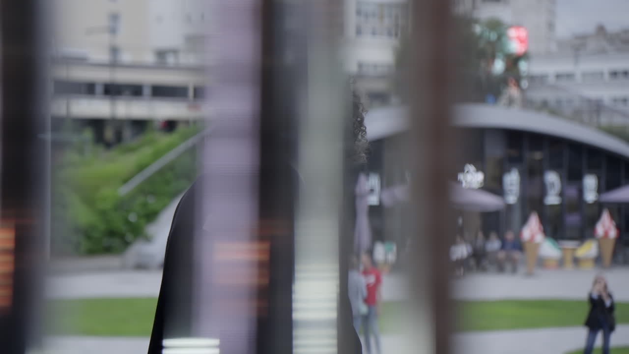 Man in Kimono Walking Through City