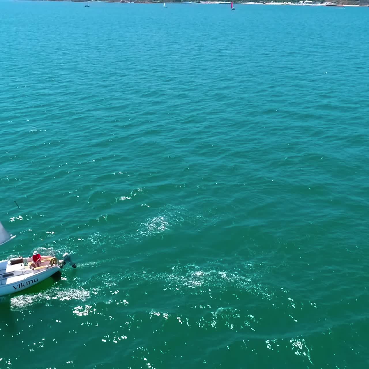 Sailing yacht in wind waves. Seascape with white sails yacht in open sea